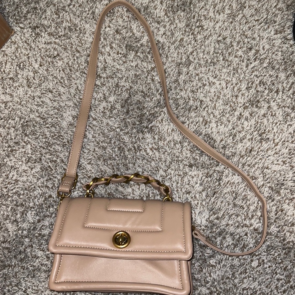 ASOS crossbody purse with gold detail. Padded Crossbody with gold chain detail.